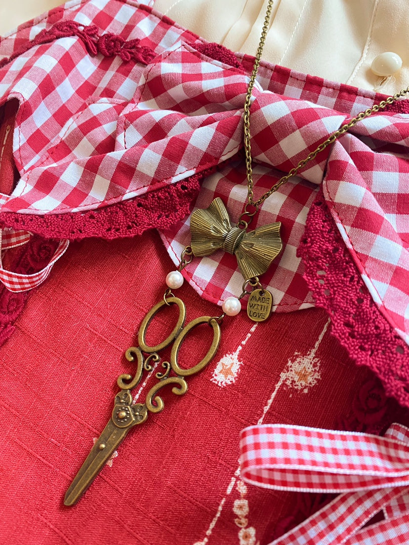 Halloween Alice - Vintage Lolita Bow-Scissors Shaped Necklace a necklace with two pearls and a scissor