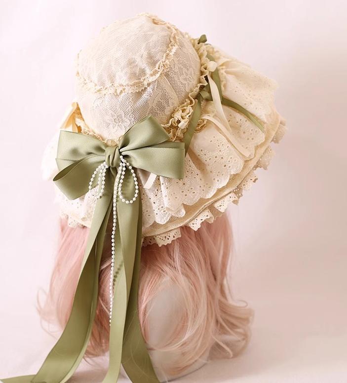 Xiaogui - Elegant Lolita Sunshade Hat Floral Bow Hats One Size. The brim has soft wires that can be shaped. Cotton ribbon in light green and beige (lace hat)