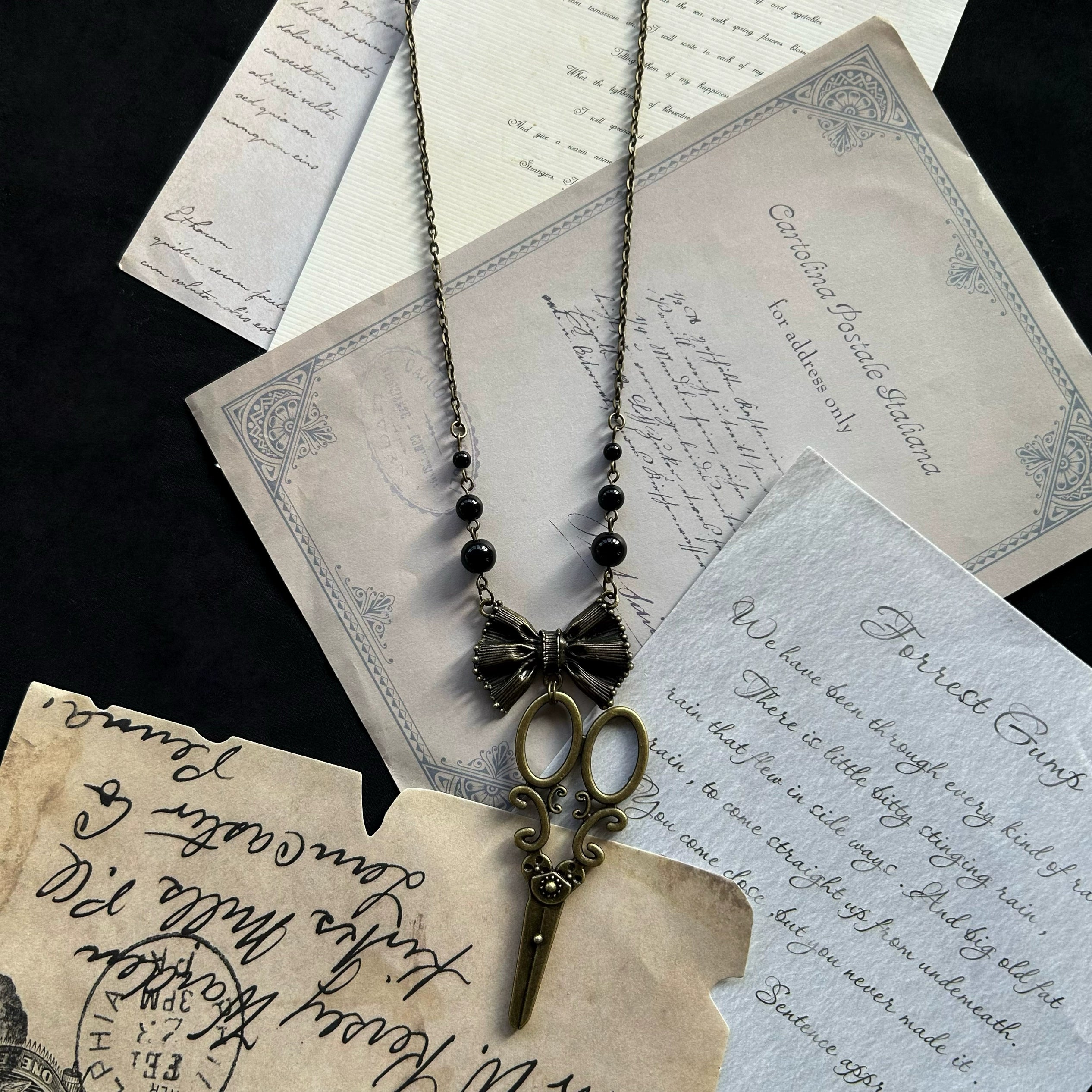 Halloween Alice - Vintage Lolita Bow-Scissors Shaped Necklace a necklace with black beads and a scissor