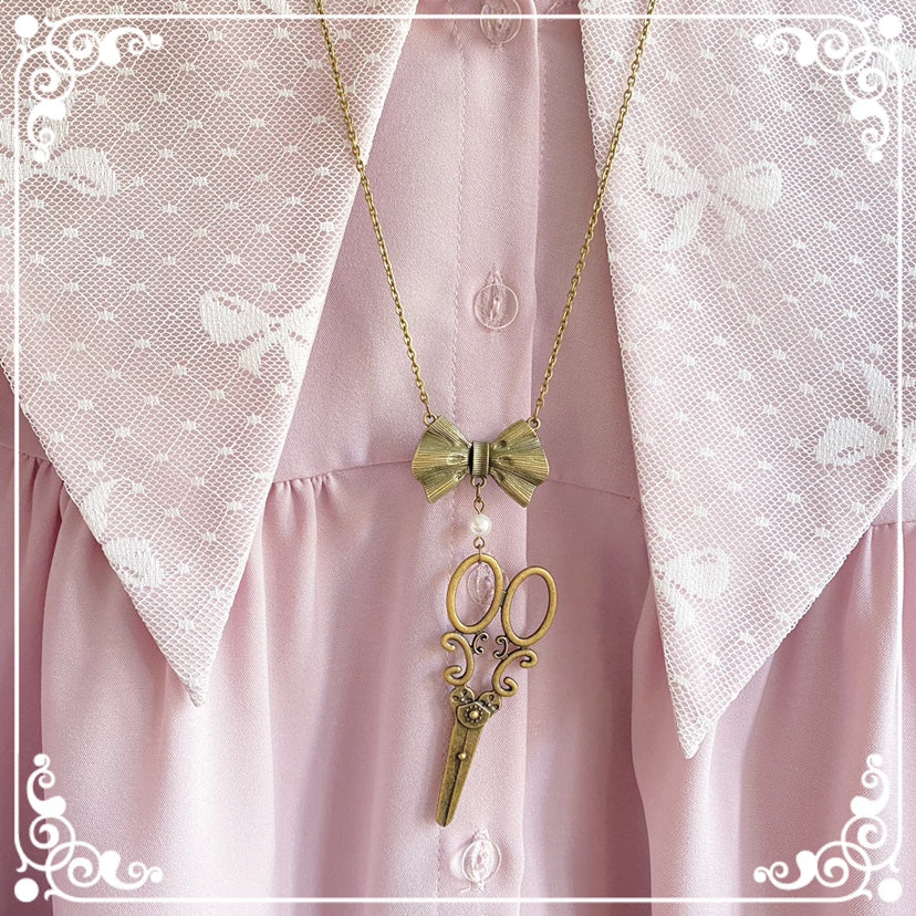 Halloween Alice - Vintage Lolita Bow-Scissors Shaped Necklace a necklace with a pearl and a scissor